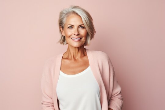 Portrait photography of a Swedish woman in her 50s against a pastel or soft colors background