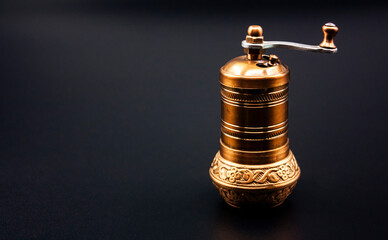 Obraz na płótnie Canvas Photograph of an ancient, handcrafted coffee grinder.