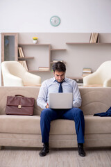 Young male employee working from home during pandemic