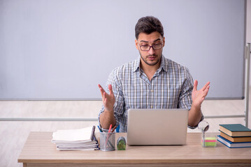 Young male student in tele-education concept