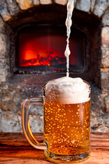 Glass Of Beer And Fireplace