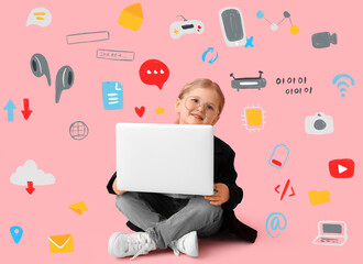 Sitting little girl with laptop on pink background