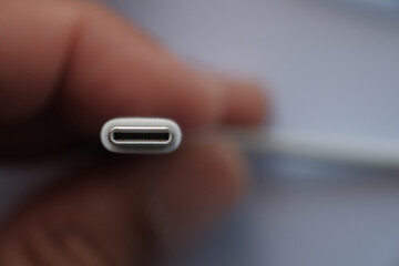 Close up USB Type C  charge socket on a hand selective focus.