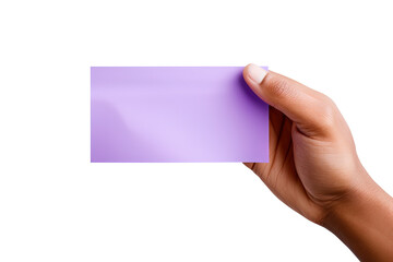 Fototapeta premium A human hand holding a blank sheet of purple paper or card isolated on a white background
