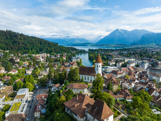 Panoramic view over Thun with its medival church at lake Thun with mount Niesen in the background,...