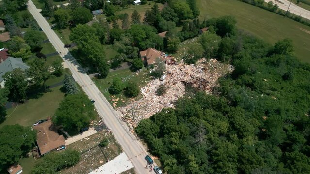 destroyed single family home, property totally damaged by propane leak disaster. aerial above shot