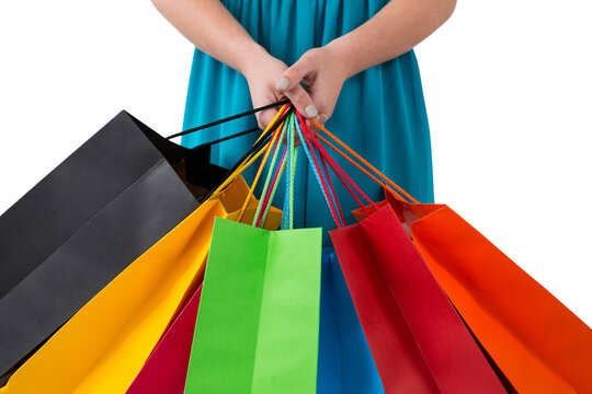 Digital png photo of hands holding present bags on transparent background