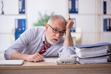 Old male employee and too much work in the office