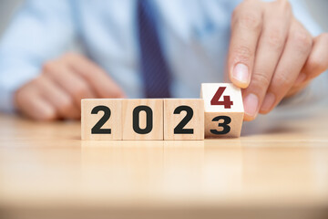New project growth concept in 2024, Preparation for happy new year , Hand of businessman flip...