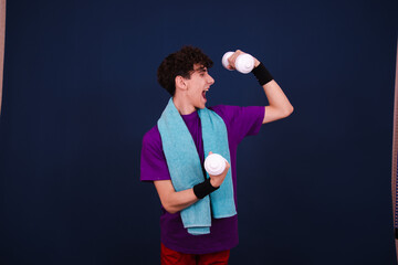 Funny curly guy doing fitness posing on a blue background. Retro style.