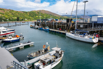 Boats docked in the port of the tourist town of Ullapool in Scotland.