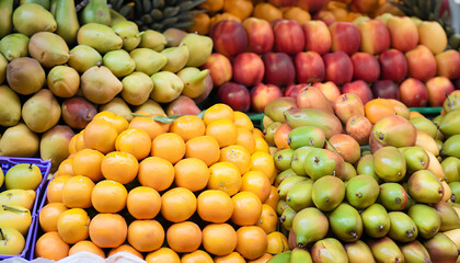 Naklejka na ściany i meble Fruits neatly placed in the fruit market