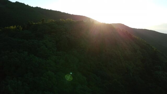Flying over the beautiful mountain ranges at dusk in a morning