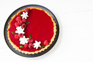Raspberry tart, white background