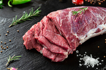 raw beef steak in black background 