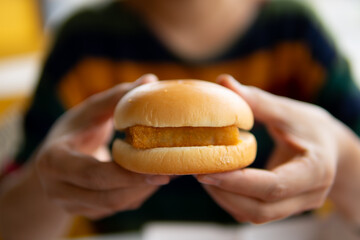 Close up women eating hamburger