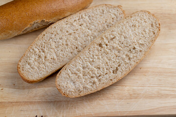 fresh wheat bread with bran on the cutting board