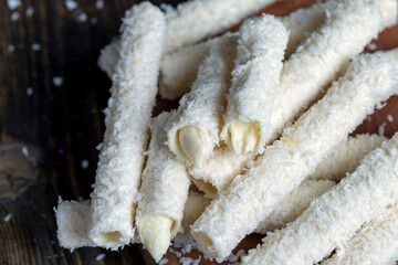 Waffle tubes with butter cream and coconut sprinkles