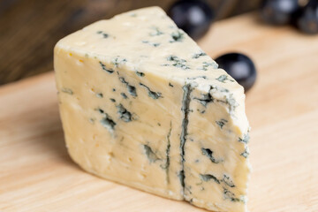 Cheese with blue mold cut into pieces
