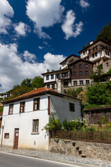 Fototapeta na wymiar Shiroka Laka, Bulgaria hill side old houses view. Old Bulgarian houses. Old Bulgarian town