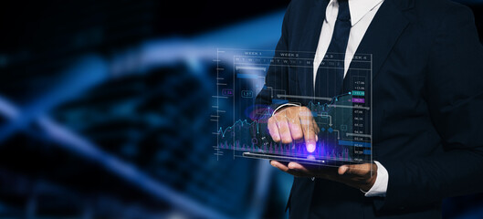 Technology and financial advisory services concept. Business hands working on digital laptop or tablet computer with business analysis and data management system for finance, Digital marketing.