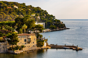 Panoramic view of Saint-Jean-Cap-Ferrat resort town on Cap Ferrat cape with exclusive estates at French Riviera of Mediterranean Sea in France