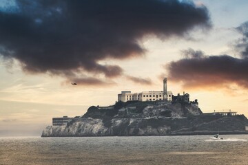 Skyline Perspective: Aerial View of Alcatraz Island with Helicopter in Frame