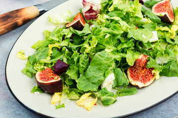 Salad with figs, herbs and cheese.