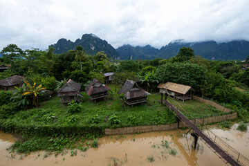 Village and mountain in Vang Vieng, Laos, Nam Song River in Vang Vieng, Laos.