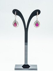 Ruby silver earrings display on white background