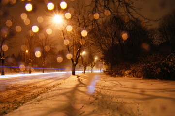 Long exposure in winter with water droplets on the lens. Trail in snow. Park in winter. Light...