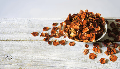 Dry rose petals in a bowl