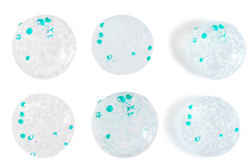 Set of transparent gel drops and balloons with blue granules. On a white background.