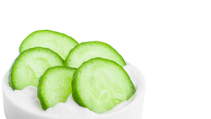 Slides of fresh cucumber in a jar of cream. On a blank background. PNG