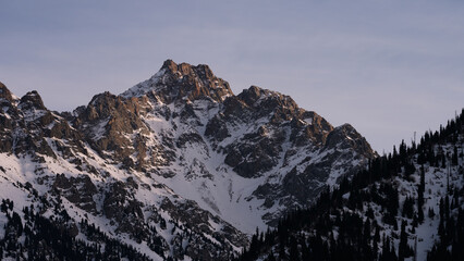 Obraz premium Alatau mountains with warm sunset light in early spring