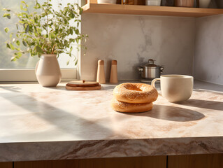 Beautiful modern kitchen countertop with fresh bagels, and a cup of coffee and tea, sunny morning breakfast