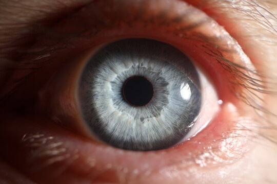 Blue eye male human super macro closeup. Healthy vision test concept