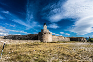 View of lighthouse standing on the ancient fortress
