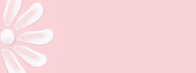 Lots of smears of cosmetic cream. Light, smooth surface. Texture of spreadable cream. Liquid creamy strokes. On a pink background. Cosmetic background, banner. - obrazy, fototapety, plakaty