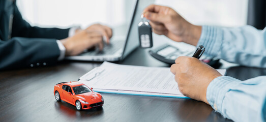 Car dealers or insurance managers cover and protect against damage and risk of driving,Hold car...