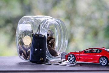 Car model on money coins pile. Finance and car loan, saving money for a car, coins insurance, loan and buying car finance concept. buy and installments down payment a car.