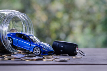 Car model on money coins pile. Finance and car loan, saving money for a car, coins insurance, loan...