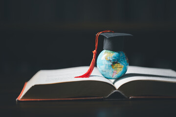 Graduated study abroad international Conceptual, Graduation hat on top Earth globe model...