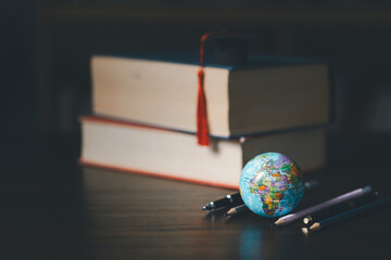 Graduated study abroad international Conceptual, Graduation hat on top Earth globe model...