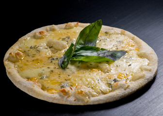 Cheesy pizza with several types of cheese