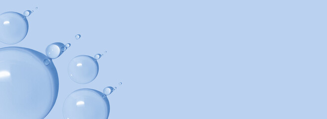 large drops of cosmetic serum, liquid, water, gel on a pink background