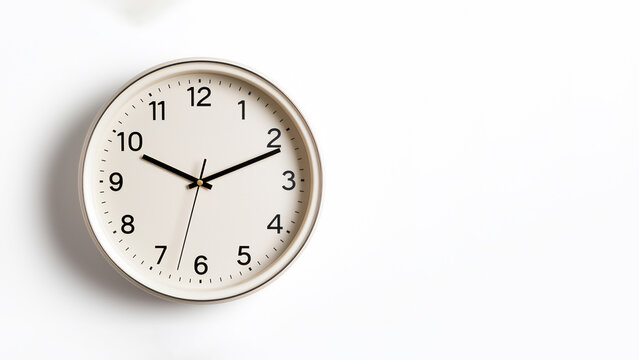 Wall clock isolated on a white background showing the time of ten past ten, computer Generative AI stock illustration image with copy space