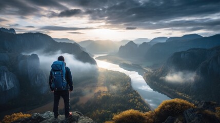 A relaxing backpacker enjoying sunset over beautiful mountains range. 