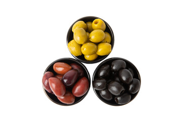 Green, black and red olives isolated on white background. Various types of olives and with fresh olive leaves. Mediterranean food. Vegan.