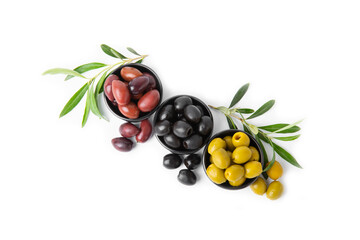 Green, black and red olives isolated on white background. Various types of olives and with fresh olive leaves. Mediterranean food. Vegan.